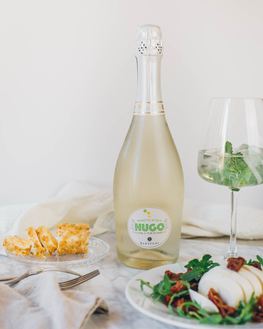 Lifestyle shot of Hugo Spritz on a marble table