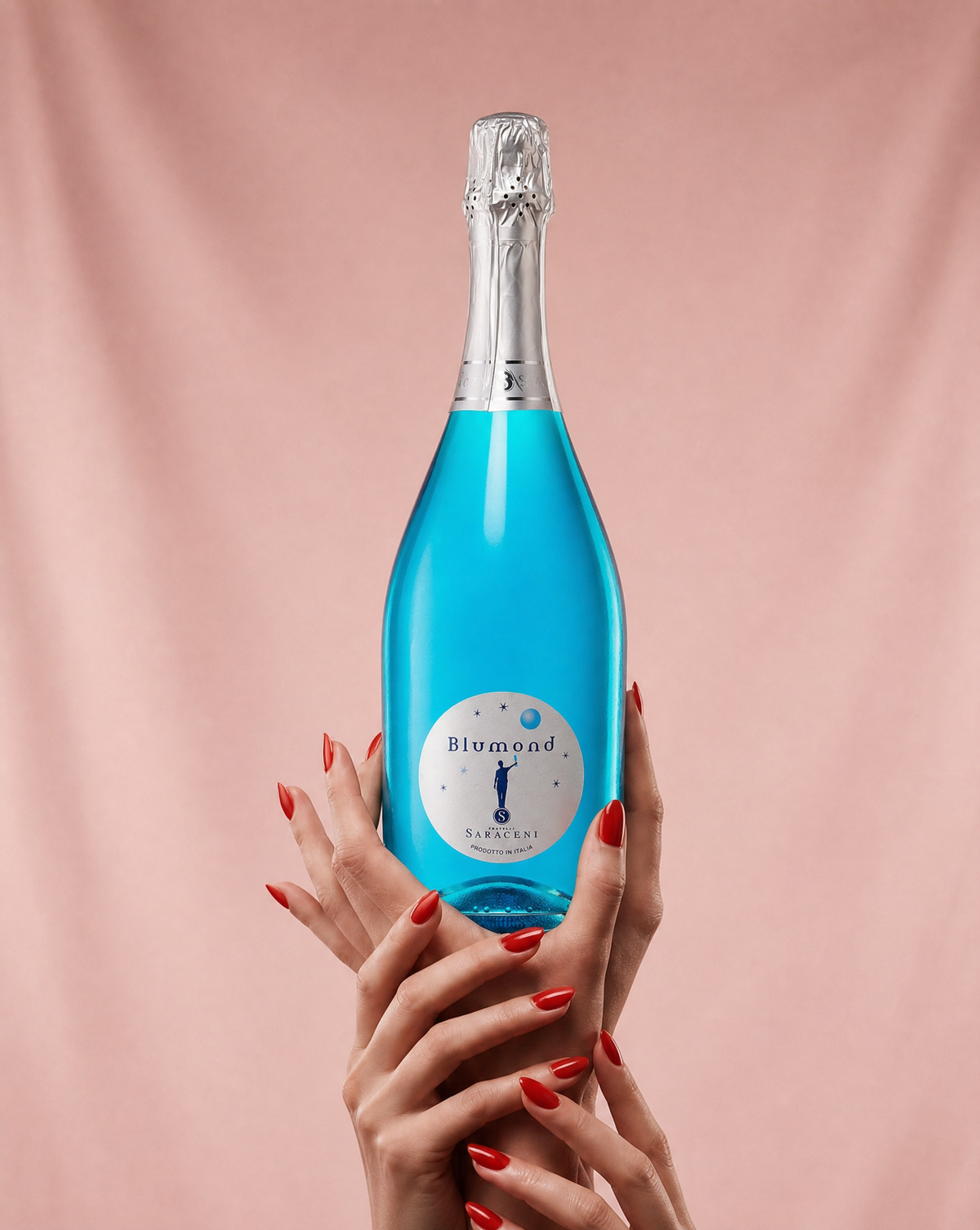 Lifestyle shot of Blumond blue sparkling wine styled for a wedding